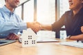 Closeup of real estate broker agent shaking hands with customer after signing contract agreement documents successfully with house Royalty Free Stock Photo