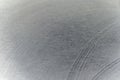 Closeup realistic gray stainless steel flat part in partial focus after industrial CNC processing at high contrast light