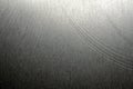 Closeup realistic gray stainless steel flat part in partial focus after industrial CNC processing at high contrast light