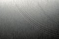 Closeup realistic gray stainless steel flat part in partial focus after industrial CNC processing at high contrast light