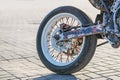 Closeup rear motorcycle wheel and exhaust pipe. Rear wheel motorcycle chain drive Royalty Free Stock Photo