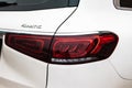 Closeup of rear red taillight on white suv. Back lights of modern car Royalty Free Stock Photo