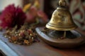 closeup of reception bell with herbal concoction aside