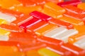 Closeup rectangular colorful shiny hard candy lined up