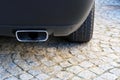 Closeup of a rectangular exhaust pipe in a sports car Royalty Free Stock Photo