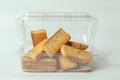 Closeup of rectangular pieces of bread inside an open transparent plastic container