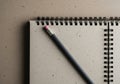 Closeup of recycled notebook and pencil on textured surface Royalty Free Stock Photo