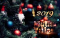 Closeup of red bauble hanging from a decorated pine tree with 2019 text. Mutlu yillar means Happy new year Royalty Free Stock Photo