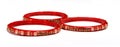 Closeup of red bracelets decorated with small stones isolated on a white background Royalty Free Stock Photo