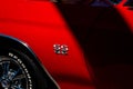 Closeup of red Chevrolet SS badge at car show