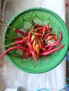 Closeup red chili peppers in basket flat lay shot