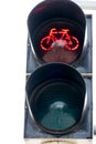 Closeup red cyclist traffic light concept bike