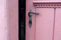 Closeup of red door with old doorhandle Royalty Free Stock Photo