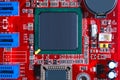 Closeup of red electronic motherboard circuit with processor Royalty Free Stock Photo