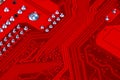 Closeup of red electronic motherboard circuit with processor Royalty Free Stock Photo