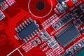 Closeup of red electronic motherboard circuit with processor Royalty Free Stock Photo