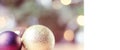 Closeup of red and gold bauble hanging from a decorated Christmas tree. Retro filter effect Royalty Free Stock Photo