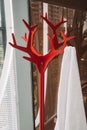 Closeup of a red hanger with a white towel Royalty Free Stock Photo