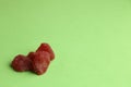 Closeup of red hard candies arranged aesthetically on one side