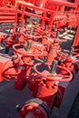 Closeup of a red industrial oil pipeline valves Royalty Free Stock Photo