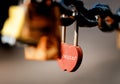 Closeup of a padlock hanging on chain link of the bridge / Fence Royalty Free Stock Photo