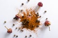 Top view of heap of red pepper powder, black peppercorns and dried red pepper on the white background Royalty Free Stock Photo