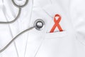 Red ribbon inserted to the pocket of lab coat