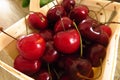 Red ripe cherries in basket closeup