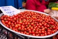 Closeup of red ripe cherry tomatoes at farmers market place Royalty Free Stock Photo