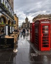 Closeup of Red telephone boxes at Edinburgh Royal Mile, Scotland during cloudy weather