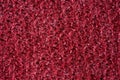 Closeup red texture of woolen knitted fabric. Pattern of red fabric Royalty Free Stock Photo