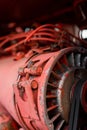 Closeup of red tractor fuel injectors four cylinder diesel engine details on sharp focus in rural Bulgarian region in autumn Royalty Free Stock Photo