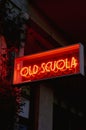 Closeup of a red vibrant neon light sign with the words "Old Scuola" Royalty Free Stock Photo