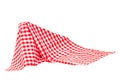 Closeup of a red and white checkered napkin or tablecloth texture isolated on white background. Kitchen accessories. Top view Royalty Free Stock Photo