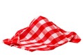Closeup of a red and white checkered napkin or tablecloth texture isolated on white background. Kitchen accessories. Top view Royalty Free Stock Photo