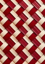 Closeup of a red and white woven basket with an apple pie inside