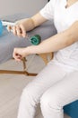 Closeup Rehabilitation Specialist, Physical Therapist Shows Rehab Tool Meso Roller With