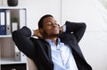 Closeup of relaxed african american businessman resting in office Royalty Free Stock Photo