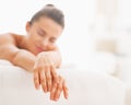 Closeup on relaxed young woman laying on massage table Royalty Free Stock Photo