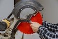 Closeup on the replacement saw blade in the electric saw