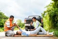 Closeup rescue workers using radio communication helping woman driver from car Royalty Free Stock Photo