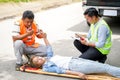 Closeup rescue workers using radio communication helping woman driver Royalty Free Stock Photo