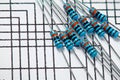 Closeup of resistors on circuit scheme - concept of learning, training and development of electric circuits