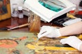 Closeup of Restorer working on the old icon Royalty Free Stock Photo