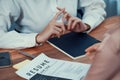 Closeup resume paper with qualifications on desk during interview. Enthusiastic