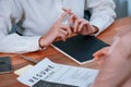 Closeup resume paper with qualifications on desk during interview. Enthusiastic