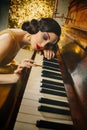 Closeup retro portrait woman musician plays piano melody touches keys her hand Royalty Free Stock Photo