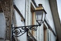 retro street light on medieval house facade in the street Royalty Free Stock Photo