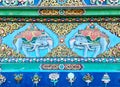 closeup of richly colored and ornate buddhist temple