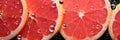 closeup ripe fresh sliced red grapefruit in drops of water top view banner Royalty Free Stock Photo